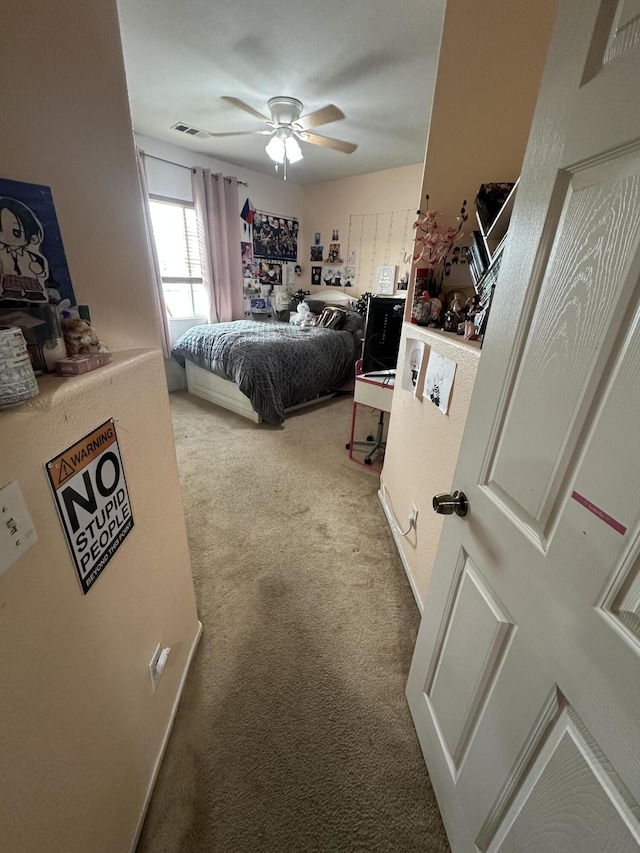 carpeted bedroom with ceiling fan