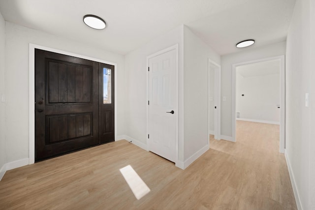 foyer entrance featuring light wood-type flooring