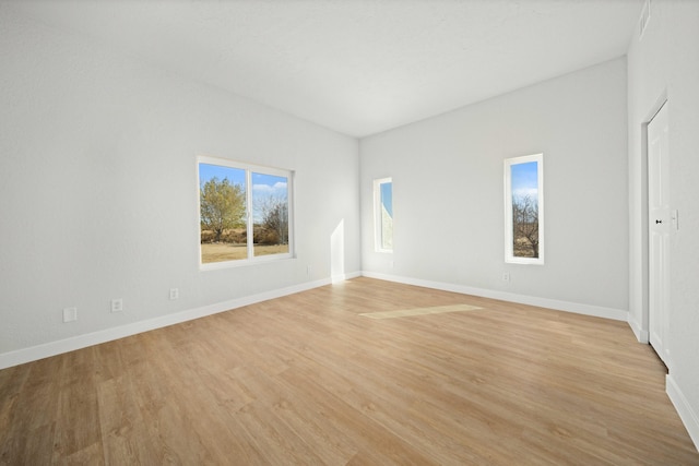 spare room featuring light wood-type flooring