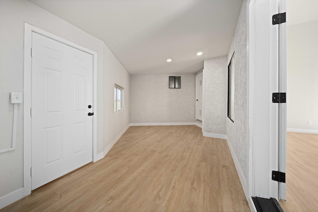 hallway with light wood-type flooring