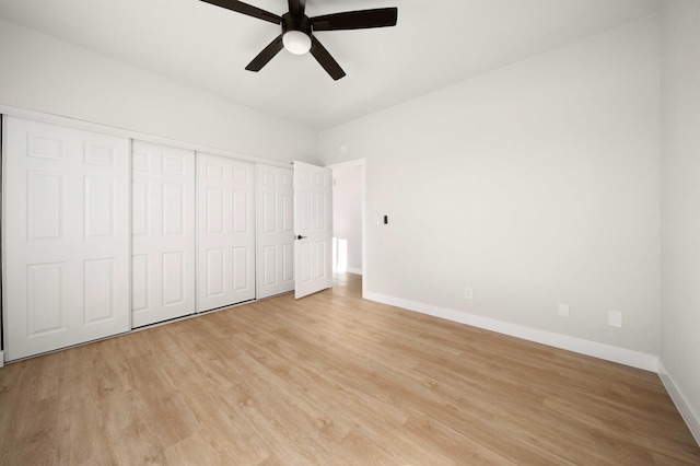 unfurnished bedroom with ceiling fan, light hardwood / wood-style floors, and a closet