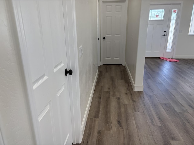 interior space featuring dark wood finished floors and baseboards