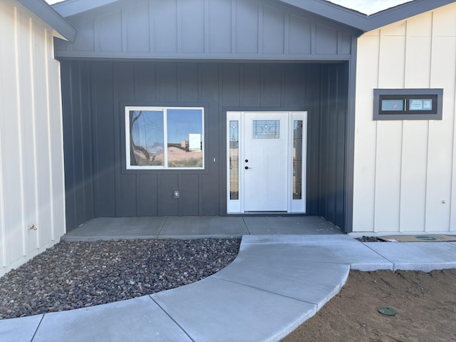 doorway to property featuring board and batten siding