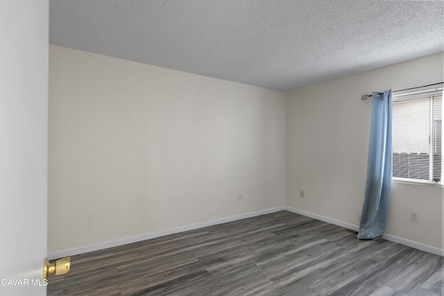 14332 Lear St, Mojave, CA 93501 - unfurnished room featuring wood finished floors and a textured ceiling