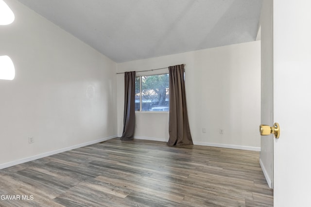 14332 Lear St, Mojave, CA 93501 - unfurnished room with lofted ceiling and wood finished floors
