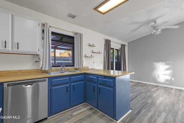 14332 Lear St, Mojave, CA 93501 - kitchen featuring dishwasher, a peninsula, blue cabinets, light countertops, and light wood-style floors