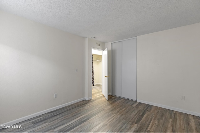 14332 Lear St, Mojave, CA 93501 - spare room featuring wood finished floors and a textured ceiling
