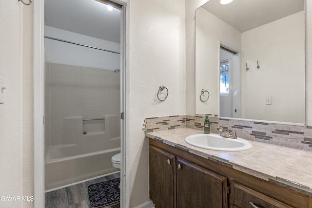 14332 Lear St, Mojave, CA 93501 - bathroom featuring vanity, decorative backsplash, and shower / bathtub combination