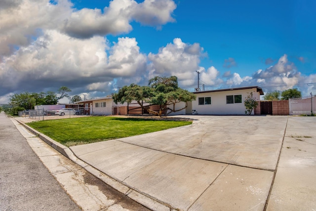 2068 Elm St, Rosamond, CA 93560 - ranch-style house featuring driveway and a gate