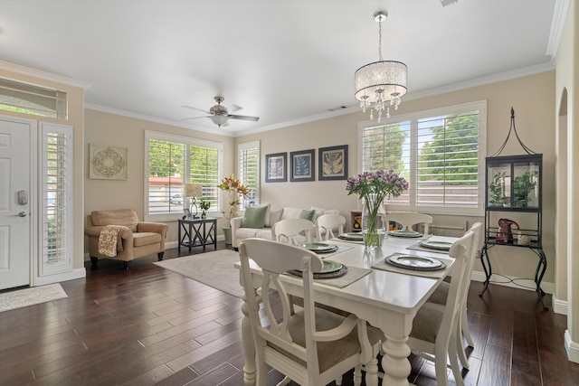 dining area with crown molding, plenty of natural light, and dark wood-style flooring