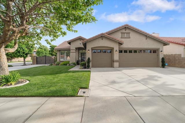 view of front facade with a gate, a garage, stucco siding, a tile roof, and concrete driveway