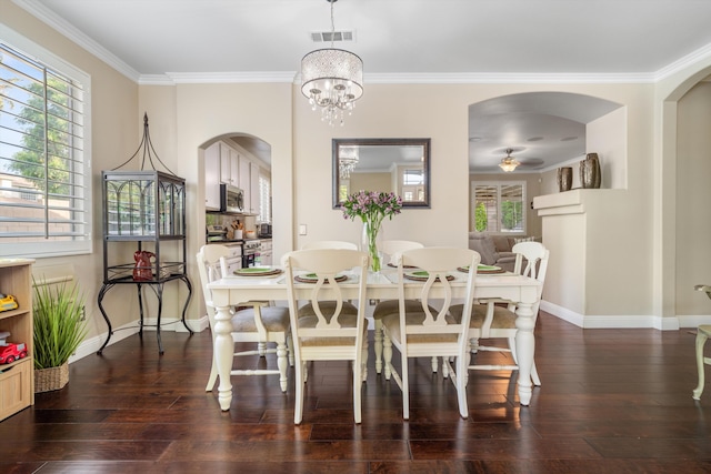 dining area with visible vents, dark wood finished floors, crown molding, arched walkways, and baseboards