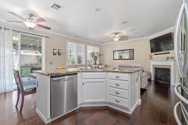 kitchen with a sink, visible vents, ceiling fan, open floor plan, and appliances with stainless steel finishes