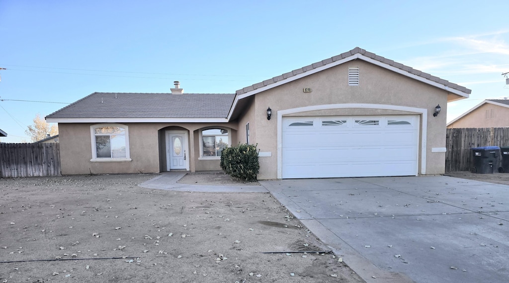 ranch-style home with a garage