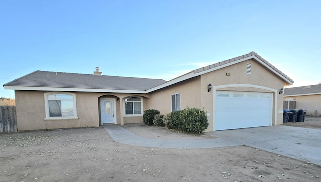 ranch-style house featuring a garage