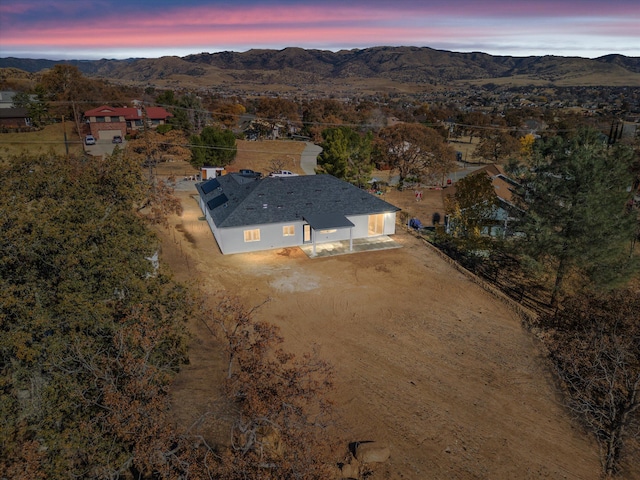 aerial view at dusk with a mountain view