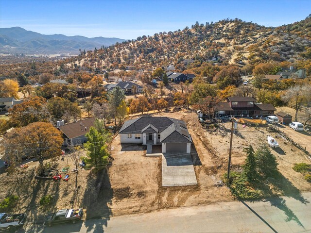 birds eye view of property with a mountain view