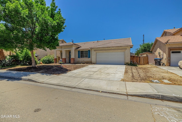 38537 E 37th St, Palmdale, CA 93550 - view of front of home featuring a garage, stucco siding, and concrete driveway