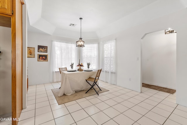 22401 Citation St, Tehachapi, CA 93561 - dining space featuring light tile patterned floors, arched walkways, and a raised ceiling