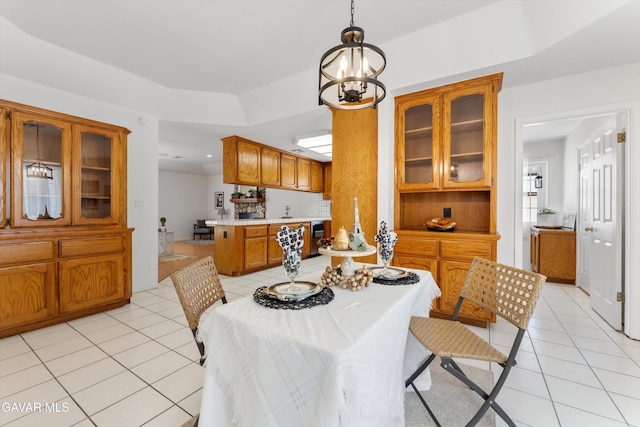 22401 Citation St, Tehachapi, CA 93561 - dining space with light tile patterned floors, a chandelier, and a tray ceiling
