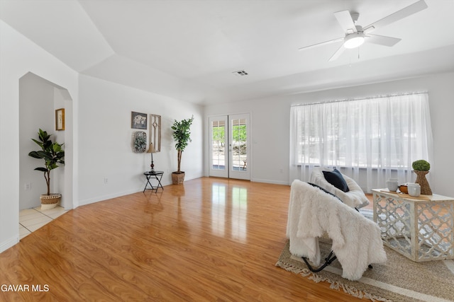 22401 Citation St, Tehachapi, CA 93561 - living room with wood finished floors, arched walkways, and a ceiling fan