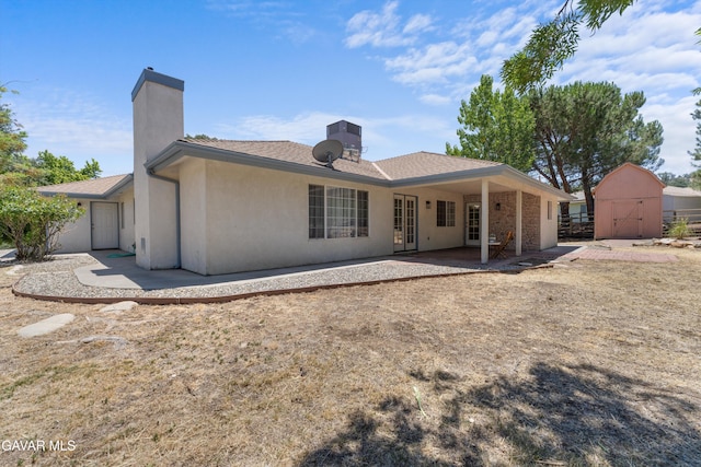 22401 Citation St, Tehachapi, CA 93561 - back of house with a shed, a patio, a chimney, and stucco siding