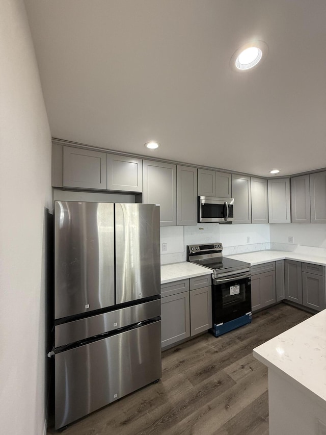 2202 E Lancaster Blvd, Lancaster, CA 93535 - kitchen with stainless steel appliances, gray cabinets, dark wood finished floors, and recessed lighting