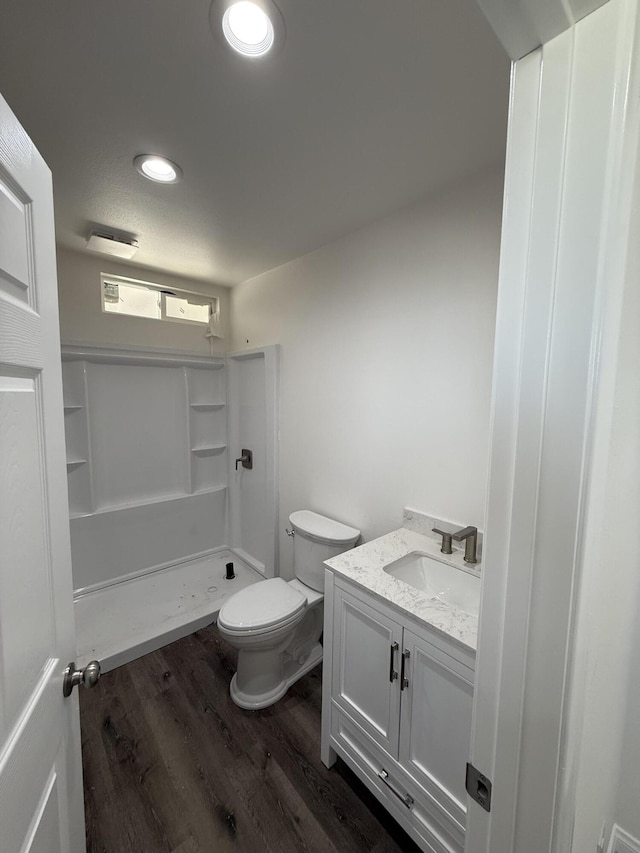 2202 E Lancaster Blvd, Lancaster, CA 93535 - full bathroom with a shower stall, wood finished floors, vanity, toilet, and recessed lighting