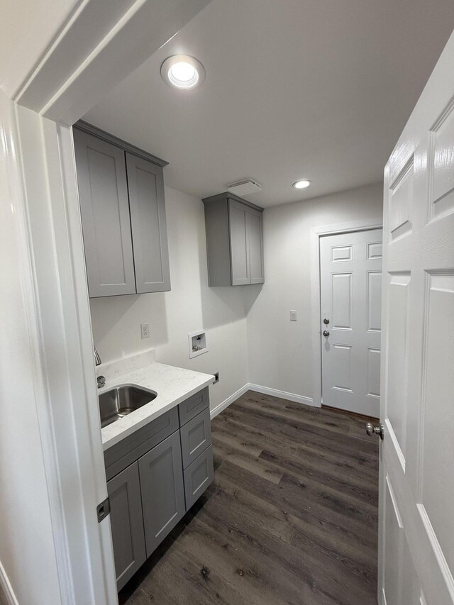 2202 E Lancaster Blvd, Lancaster, CA 93535 - laundry room featuring washer hookup, cabinet space, dark wood-type flooring, recessed lighting, and baseboards