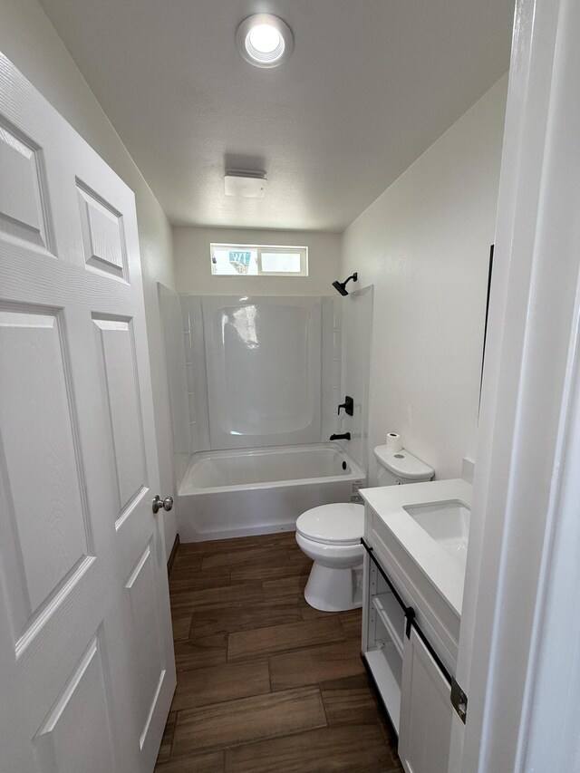 2202 E Lancaster Blvd, Lancaster, CA 93535 - bathroom with vanity, toilet,  shower combination, and wood finished floors