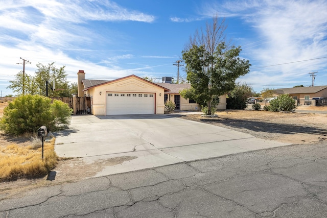 ranch-style home featuring a garage