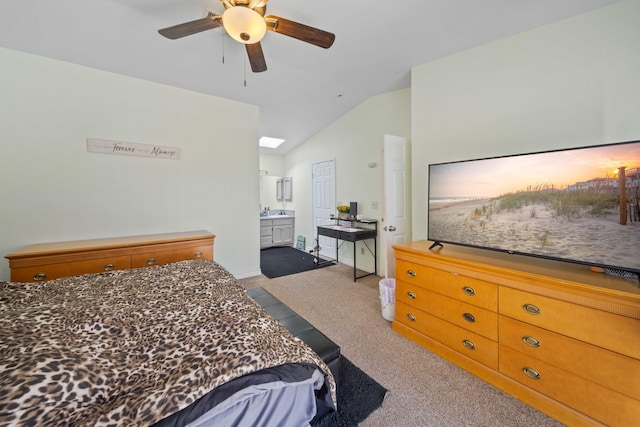 carpeted bedroom featuring connected bathroom, ceiling fan, and vaulted ceiling