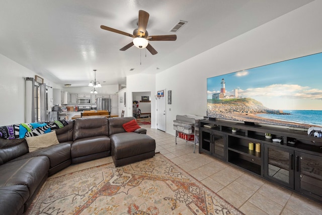 living room featuring ceiling fan and light tile patterned floors