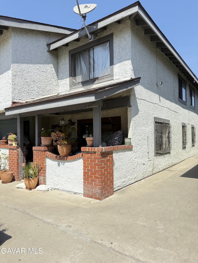 1239 W Rosecrans Ave Unit 31, Gardena, CA 90247 - rear view of property with stucco siding
