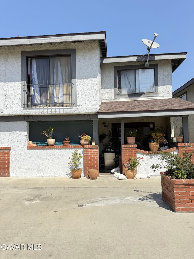 1239 W Rosecrans Ave Unit 31, Gardena, CA 90247 - view of front of house featuring stucco siding
