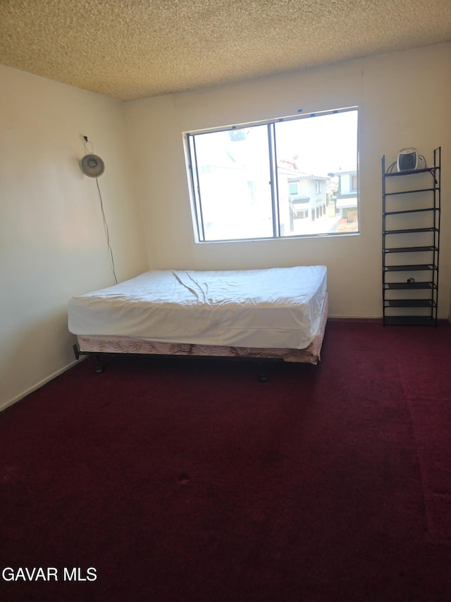 1239 W Rosecrans Ave Unit 31, Gardena, CA 90247 - bedroom with carpet flooring and a textured ceiling