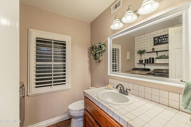 42725 Deer Walk Rd, Lake Hughes, CA 93532 - half bathroom with backsplash, vanity, and wood finished floors