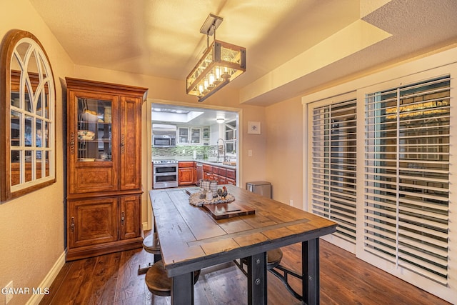 42725 Deer Walk Rd, Lake Hughes, CA 93532 - dining room with dark wood-style flooring and baseboards