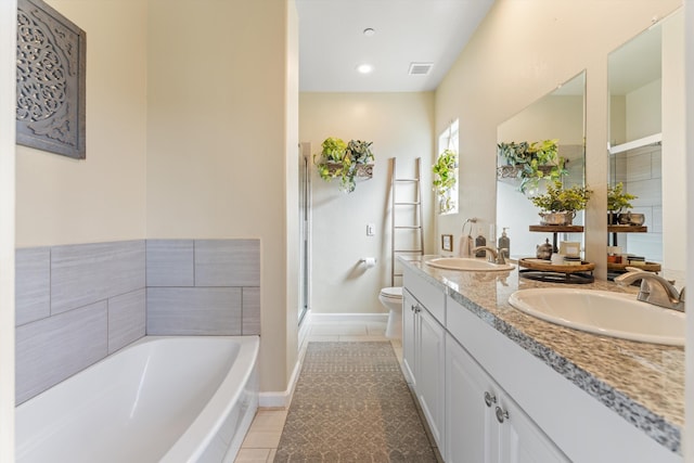 full bath with a garden tub, tile patterned floors, toilet, double vanity, and a shower stall