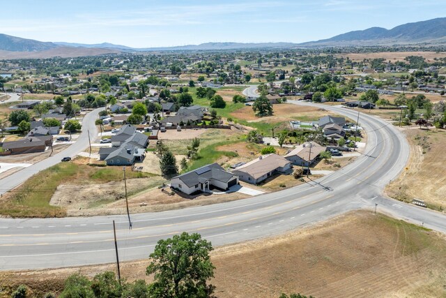 aerial perspective of suburban area featuring a mountainous background