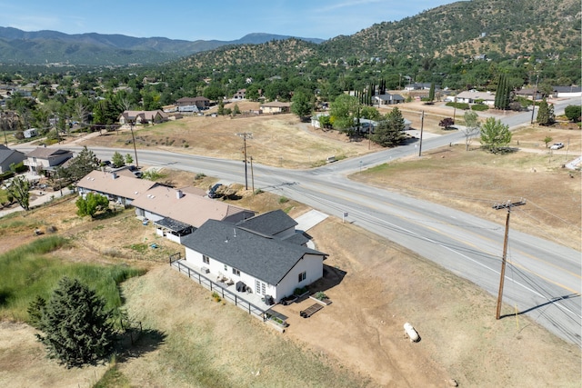 aerial view of residential area featuring mountains
