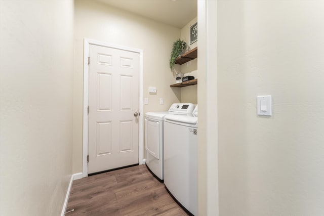 laundry area featuring separate washer and dryer and light wood finished floors