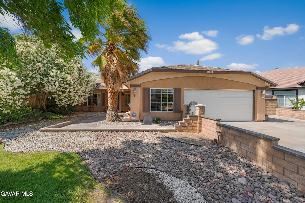6141 Charlotte Pl, Palmdale, CA 93552 - single story home featuring stucco siding, driveway, a garage, and a tiled roof