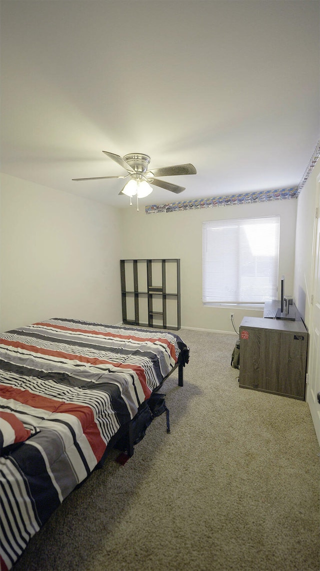 bedroom with ceiling fan and carpet floors