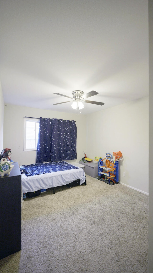 bedroom featuring ceiling fan and carpet floors