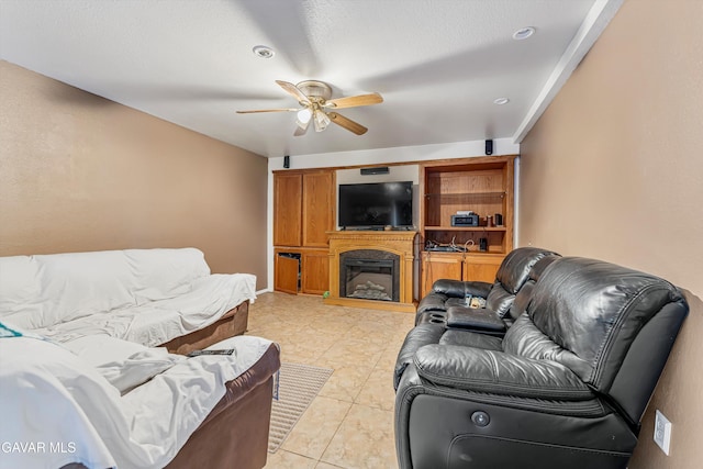 24750 Flatiron Ct, Tehachapi, CA 93561 - living room with a ceiling fan and a glass covered fireplace