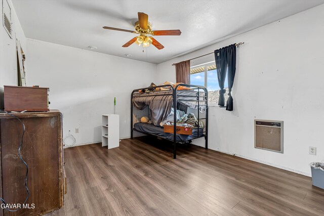 24750 Flatiron Ct, Tehachapi, CA 93561 - bedroom with wood finished floors, heating unit, and ceiling fan