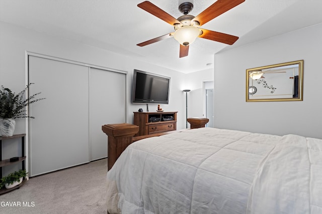 3267 Desert Cloud Ave, Rosamond, CA 93560 - bedroom featuring a closet, light colored carpet, and a ceiling fan
