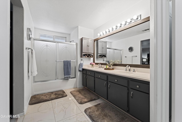 3267 Desert Cloud Ave, Rosamond, CA 93560 - bathroom featuring double vanity, combined bath / shower with glass door, and marble look tile flooring
