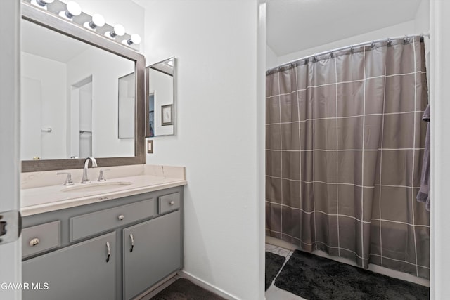 3267 Desert Cloud Ave, Rosamond, CA 93560 - bathroom featuring vanity and a shower with shower curtain